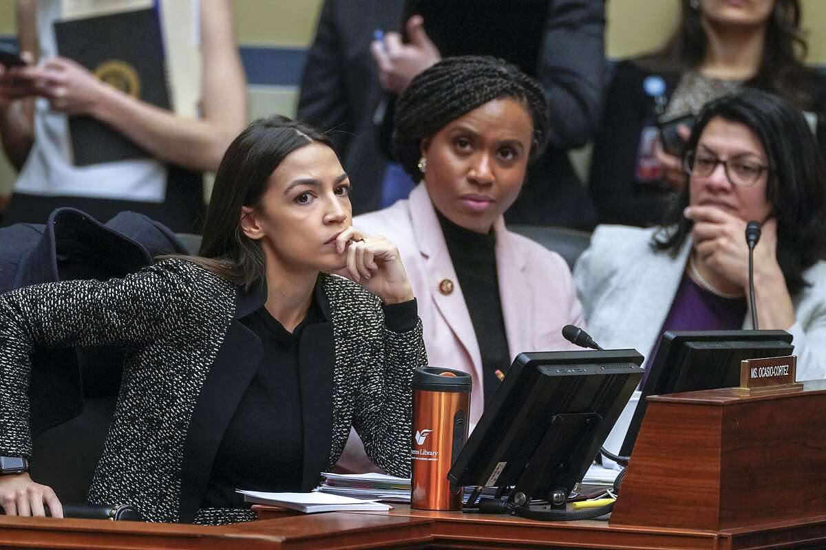 Rep. Alexandria Ocasio-Cortez, D-N.Y., left, joined by Rep. Ayanna Pressley, D-Mass., and Rep. Rashida Tlaib, D-Mich., listens during a House Oversight and Reform Committee meeting, on Capitol Hill in Washington, Tuesday, Feb. 26, 2019. House Democrats are rounding the first 100 days of their new majority taking stock of their accomplishments, noting the stumbles and marking their place as a frontline of resistance to President Donald Trump. (AP Photo/J. Scott Applewhite)