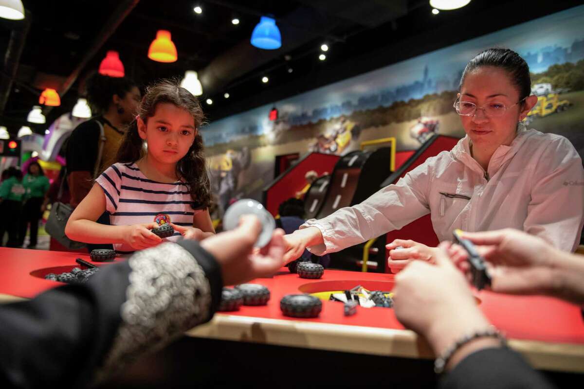 Elizabeth Marcos, 5, and Nidia Pichardo of Salt Lake City, Utah, build cars at the Build and Test portion of LEGOLAND Discovery Center on Friday, April 12, 2019.