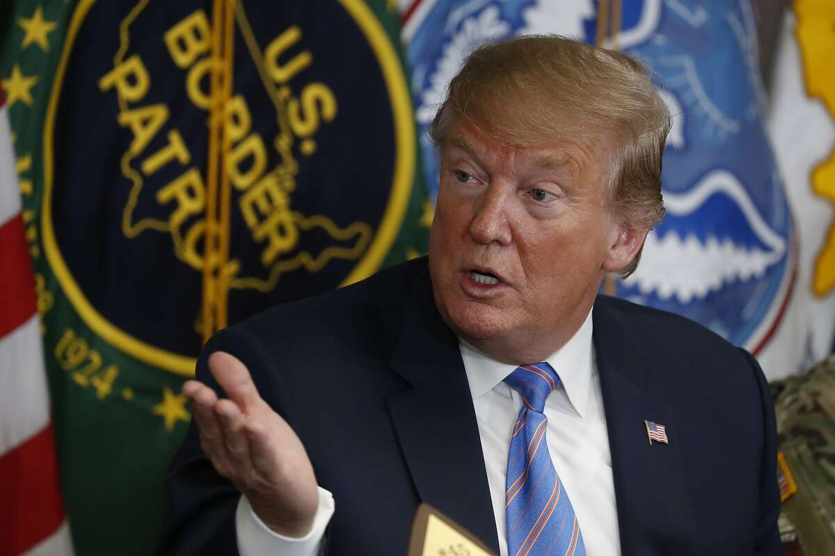 In this April 5, 2019 photo, President Donald Trump participates in a roundtable on immigration and border security at the U.S. Border Patrol Calexico Station in Calexico, Calif. Trump said Friday he is considering sending "Illegal Immigrants" to Democratic strongholds to punish them for inaction— just hours after White House and Homeland Security officials insisted the idea was dead on arrival. (AP Photo/Jacquelyn Martin)