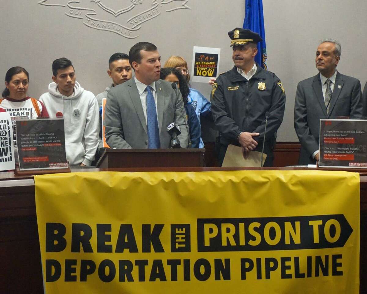 (Center) State Rep. Steve Stafstrom, D-Bridgeport, spoke in favor of strengthening Connecticut's TRUST Act at the state Capitol in Hartford, Conn. on Friday March 8, 2019 with (center right) New Haven Police Assistant Chief Luis Casanova and (far right) Sen. Saud Anwar, D-South Windsor.