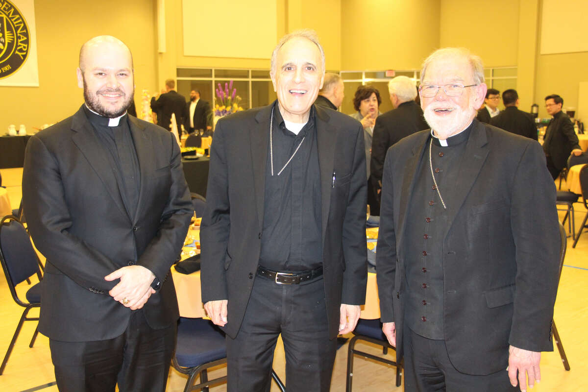 Father Jeff Bame, Cardinal Daniel DiNardo (center) and Auxiliary Bishop George Sheltz at a dinner at St. Mary's Seminary in Houston April 10, 2019. >> See photos of Daniel DiNardo's 2007 journey to the Vatican to become a cardinal....