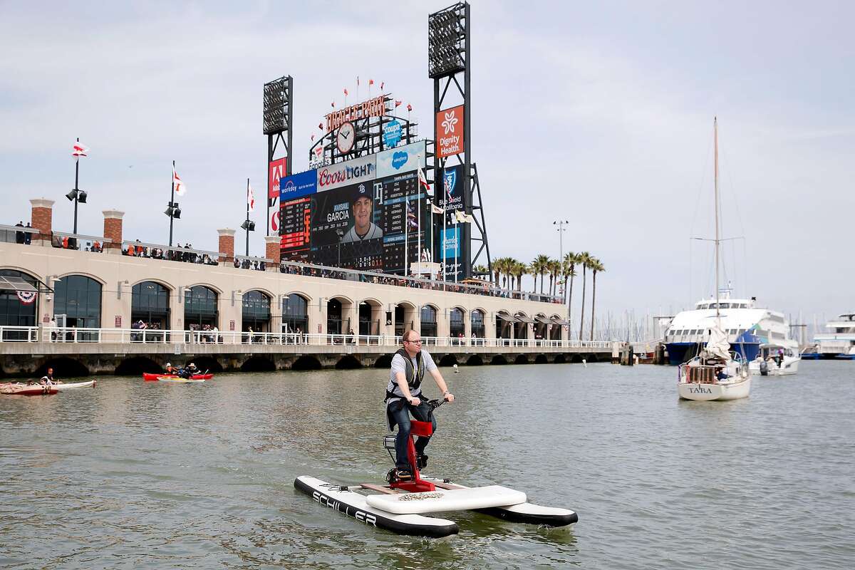 Matthew Shambroom pedals an electric-assisted water bikes during a demonstration of the bikes at McCovey Cove in San Francisco, Calif. on Sunday, April 7, 2019.