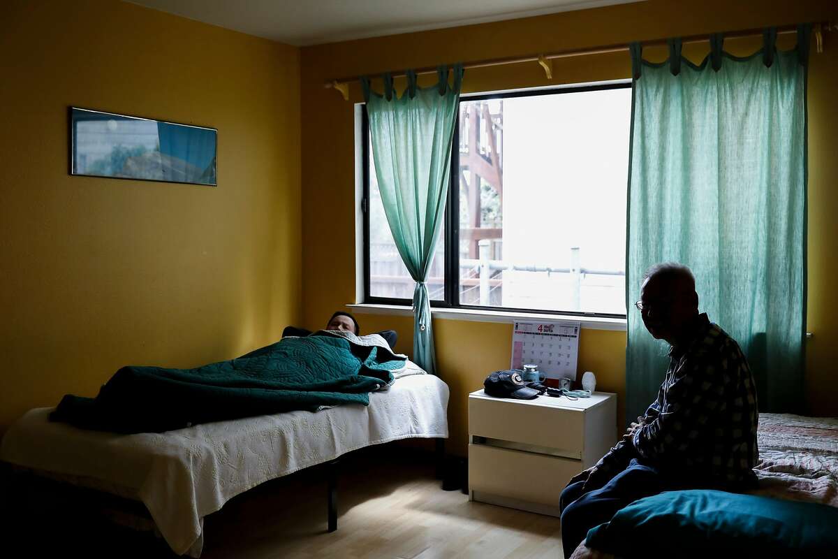 (From left) Residents Van Hung and Wing Mou Chan relax in their bedroom at Aurora Concepcion's Residential Care Home in San Francisco, Calif. Friday, April 5, 2019. San Francisco has lost more than a third of these residential facilities that serve people younger than 60 since 2012.