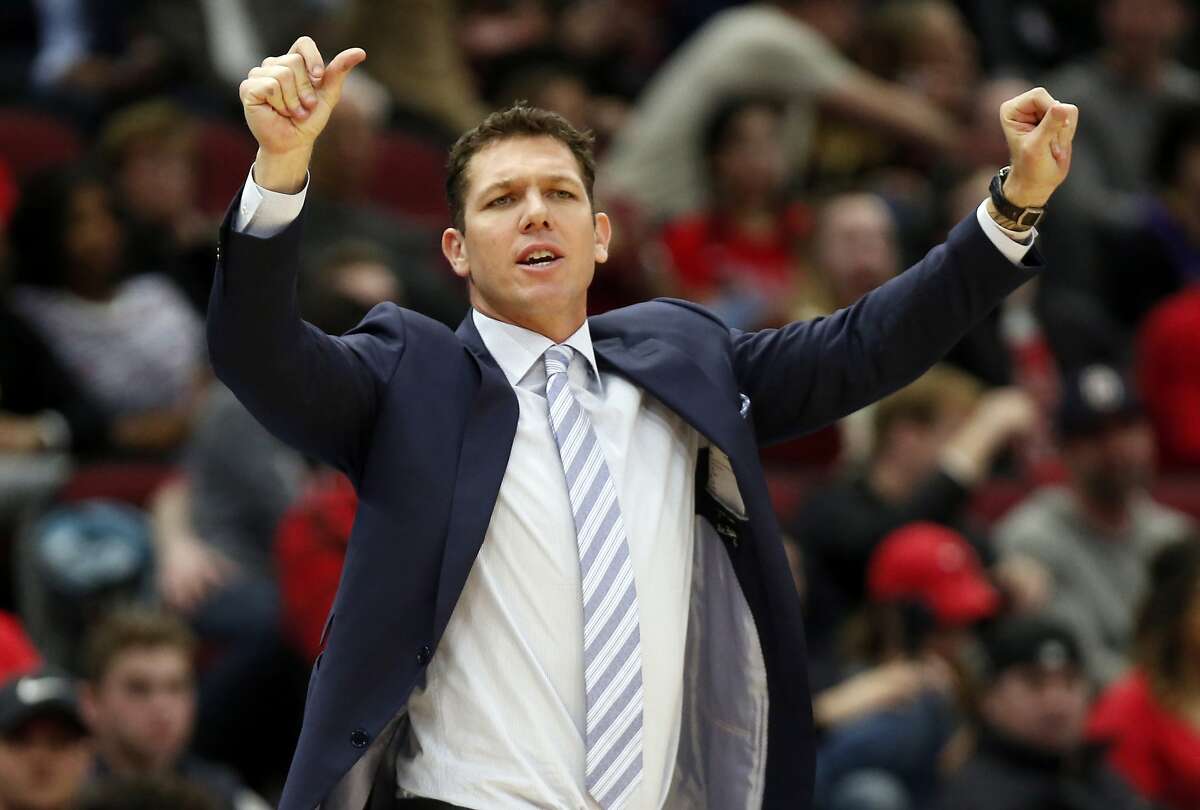 FILE - In this March 12, 2019, file photo, Los Angeles Lakers coach Luke Walton gestures to players during the second half of an NBA basketball game against the Chicago Bulls in Chicago. The Lakers say they have mutually agreed to part ways with Walton after three losing seasons. Lakers general manager Rob Pelinka announced Walton's departure Friday, April 12, 2019. (AP Photo/Nuccio DiNuzzo,File)