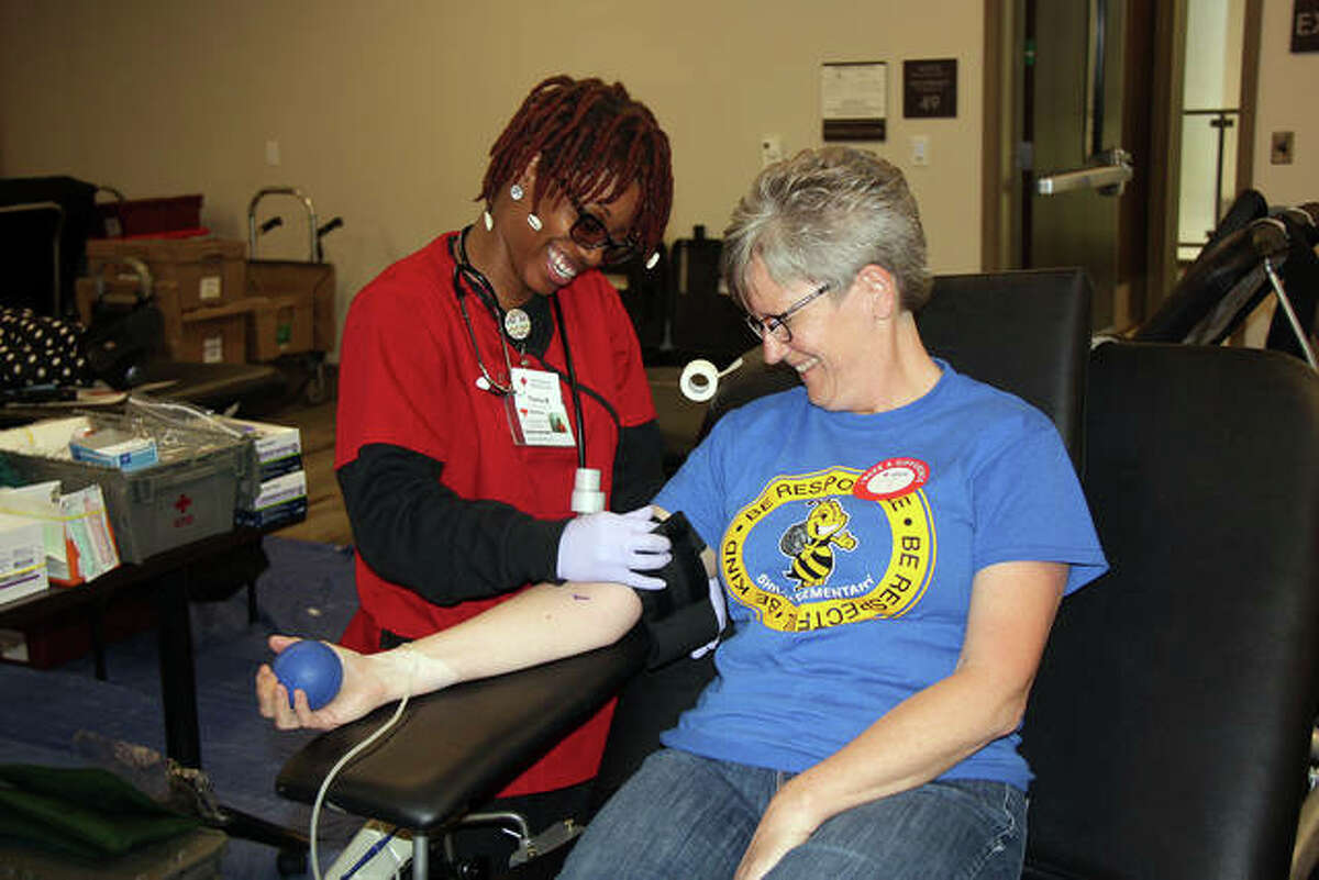 L&C Veterans Club will host the KSHE-95 Winter Blood Drive on Friday from 10 a.m. - 6 p.m. in the Hatheway Cultural Center Gallery at 5800 Godfrey Road, Godfrey. Appointments on required.  Pictured Lonna Allen, of Edwardsville, right, awaits her turn to give back with the help of Red Cross Blood Tech Tierra Brown during a Battle of the Badges Blood Drive in Edwardsville. 