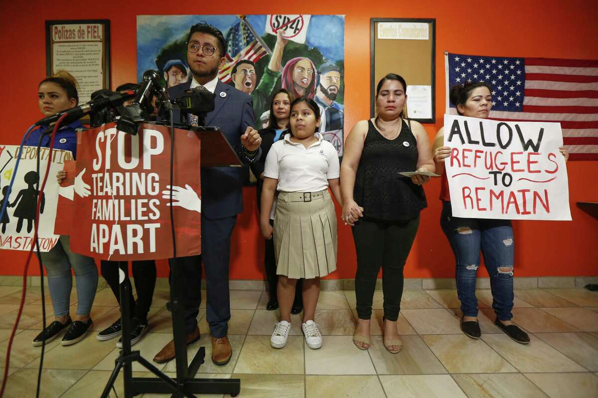 Cesar Espinosa, center, executive director at FIEL Houston Inc., talks about 11-year-old Laura Maradiaga, (third from right), who is facing deportation back to El Salvador Thursday, April 11, 2019, in Houston. From left to right, Laura's sisters, Katherine Maradiaga, 21, Adamaris Alvarado,15, immigration attorney Silvia Mintz, Laura’s mother Dora Alvarado, and an aunt.
