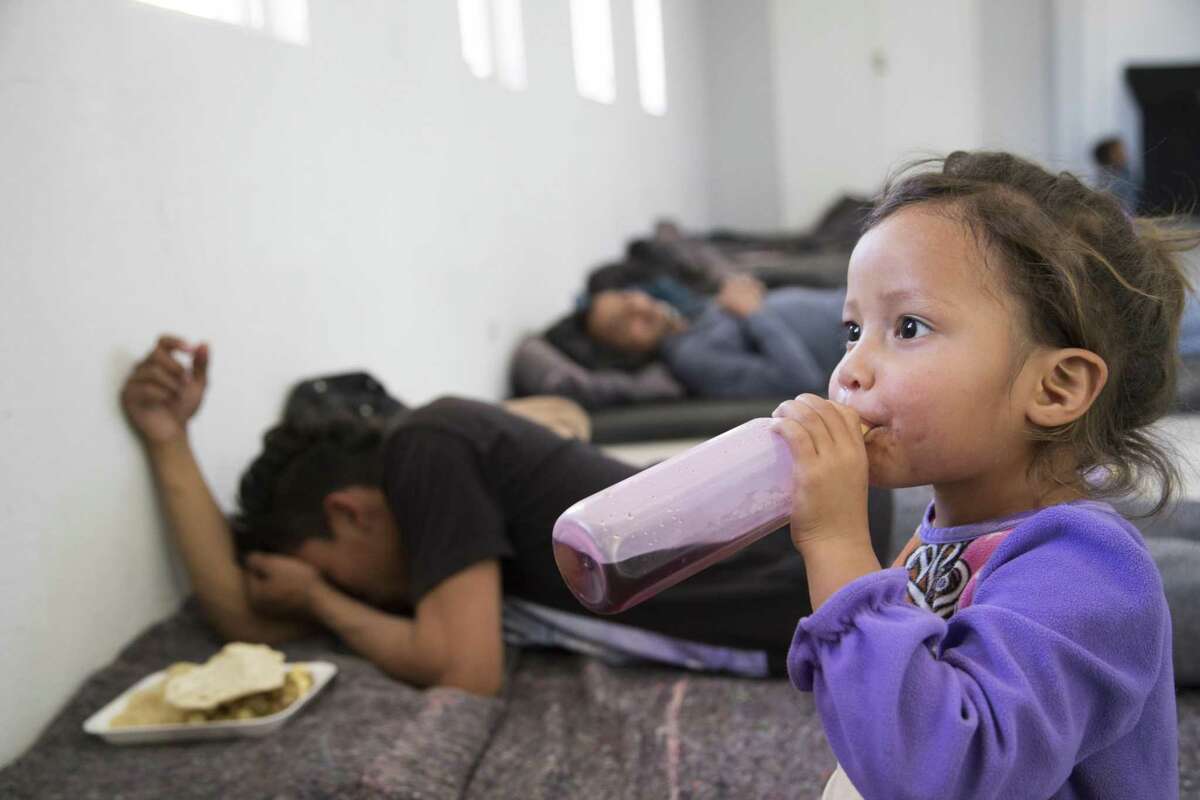 Jennifer, 2, drinks a coke from a bottle at the shelter her family are staying at on Monday, April 8, 2019, in Ciudad Juárez.