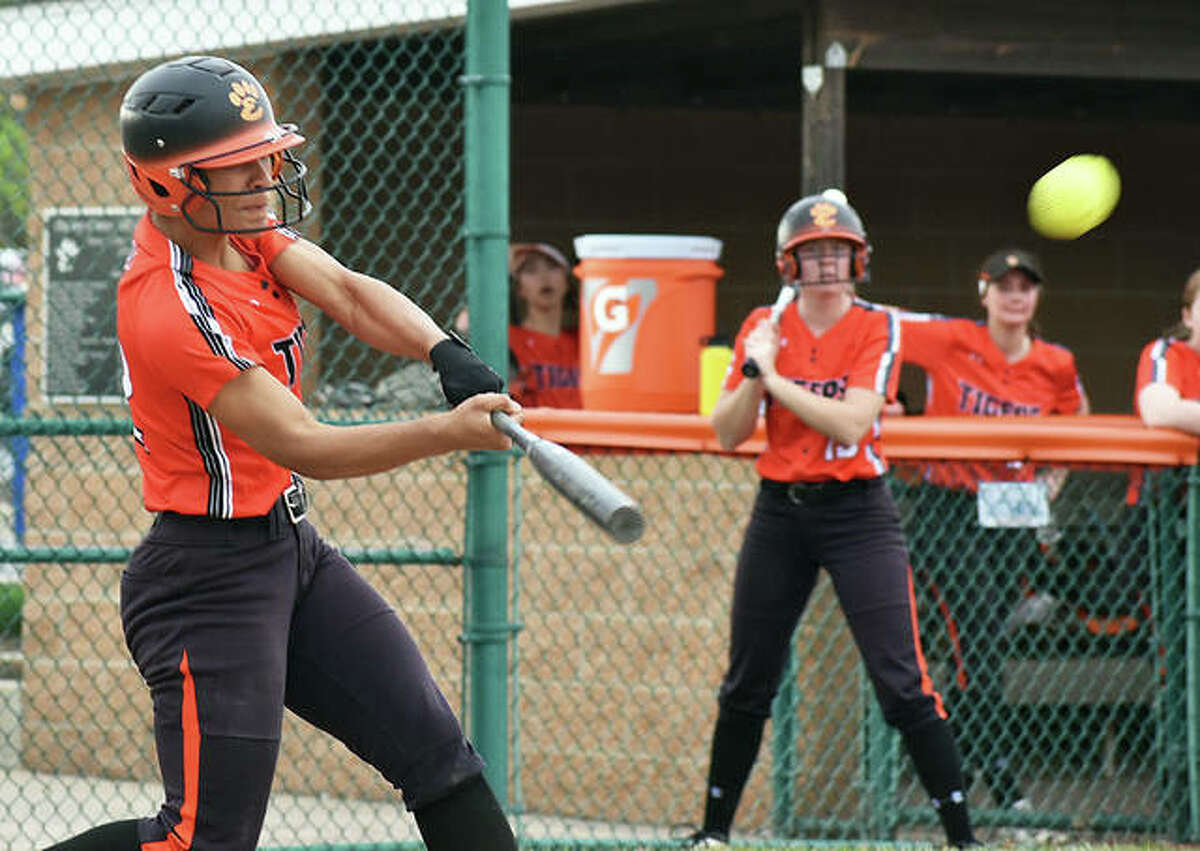 Edwardsville shortstop Maria Smith muscles up for a home run against Alton on Wednesday inside the District 7 Sports Complex.