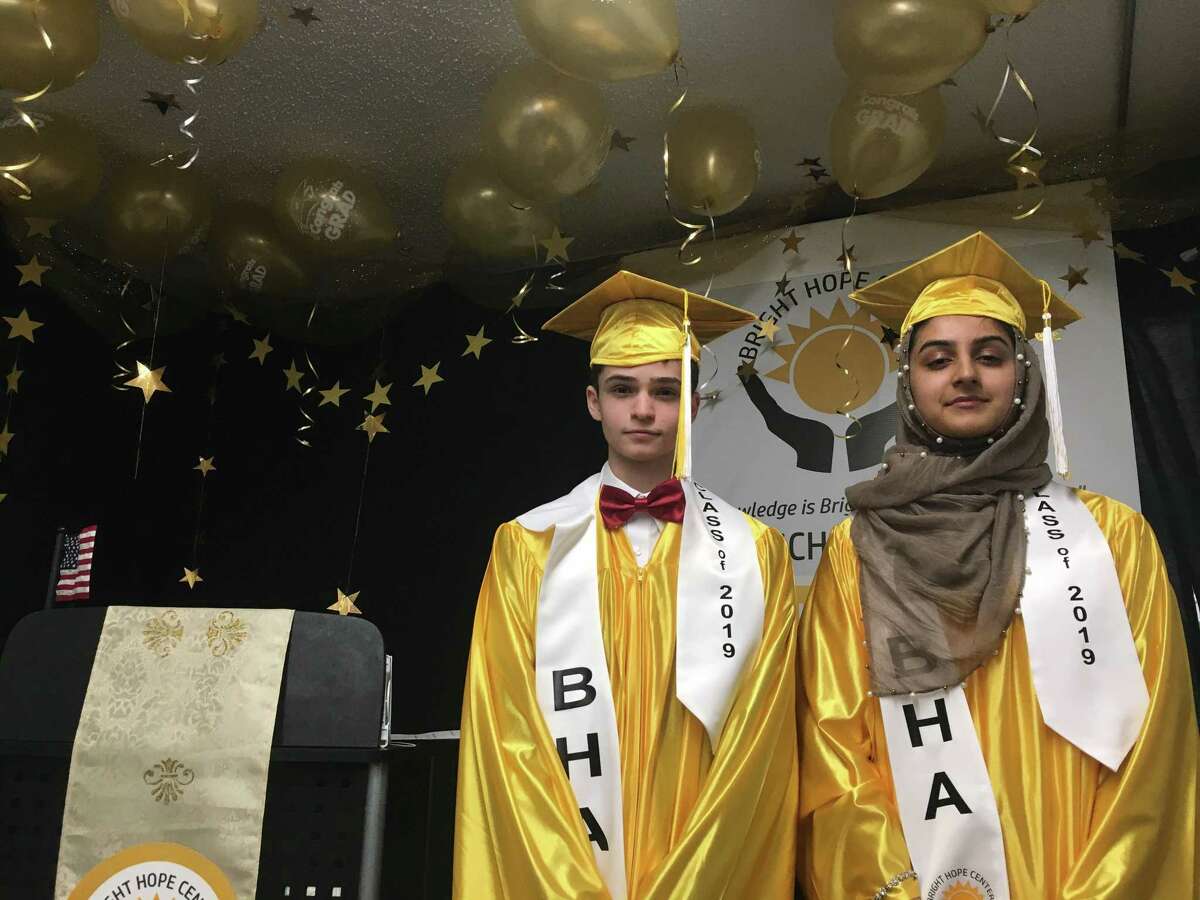 Mohammad Dhailia, 15, and Elham Malik, 14, graduated from Bright Hope Academy Center on Saturday. The duo will attend the College of St. Rose in the fall.