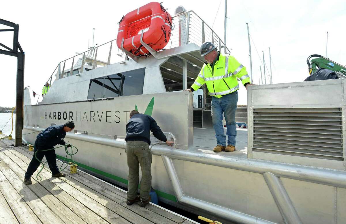 Norwalk native, boat builder and owner of Harbor Harvest market, Robert Kunkel, his friends, family and associates, help launch the northeast's first hybrid electric catamaran with refrigeration, The Captain Ben Moore, on Friday April 12, 2019, at Derecktor Shipyards in Mamoroneck, NY. The launch of the vessel is the first step toward Kunkel's goal of creating an emissions-free eco-delivery marine coastal farm-to-table distribution network and taking the stress off I-95.