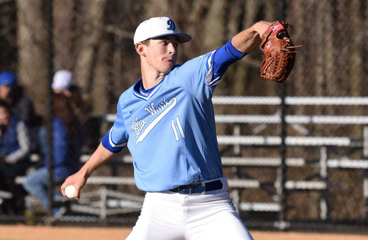 Darien’s Henry Williams throws a pitch during the Blue Wave’s baseball game against the Trumbull Eagles at Darien High School on Wednesday, April 10.