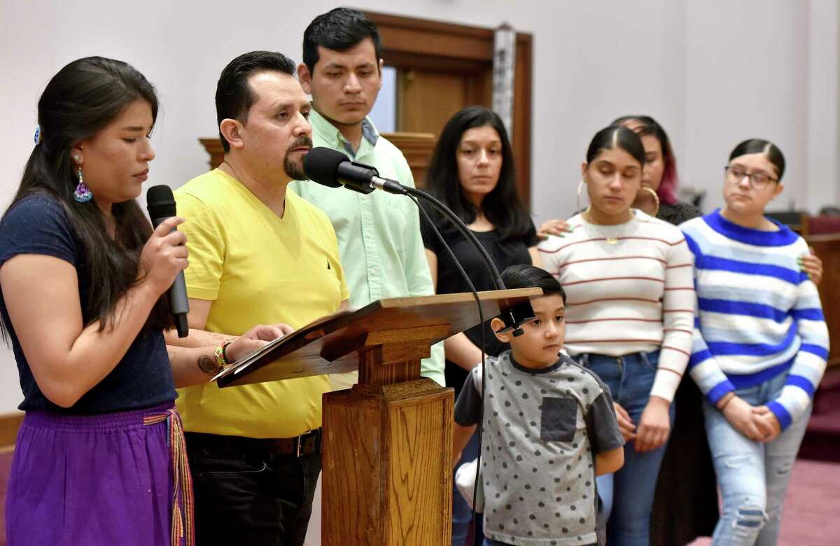 New Haven, Connecticut - Saturday, April 13, 2019: Nelson Pinos, an undocumented immigrant from Ecuador facing deportation and in his 500th day in sanctuary at the First and Summerfield Church in New Haven Saturday, addresses supporters at the opening of a photographic exhibition fundraising event for him and his family Saturday evening at the church. The photo exhibit documents Pinos, in sanctuary in New Haven since November 30, 2017, and Sujitno Sajuti, in sanctuary in Meriden since October 10. 2017. Pinos, a resident of New Haven, has lived in the U.S. since 1992. He is married and the father of three American citizen children