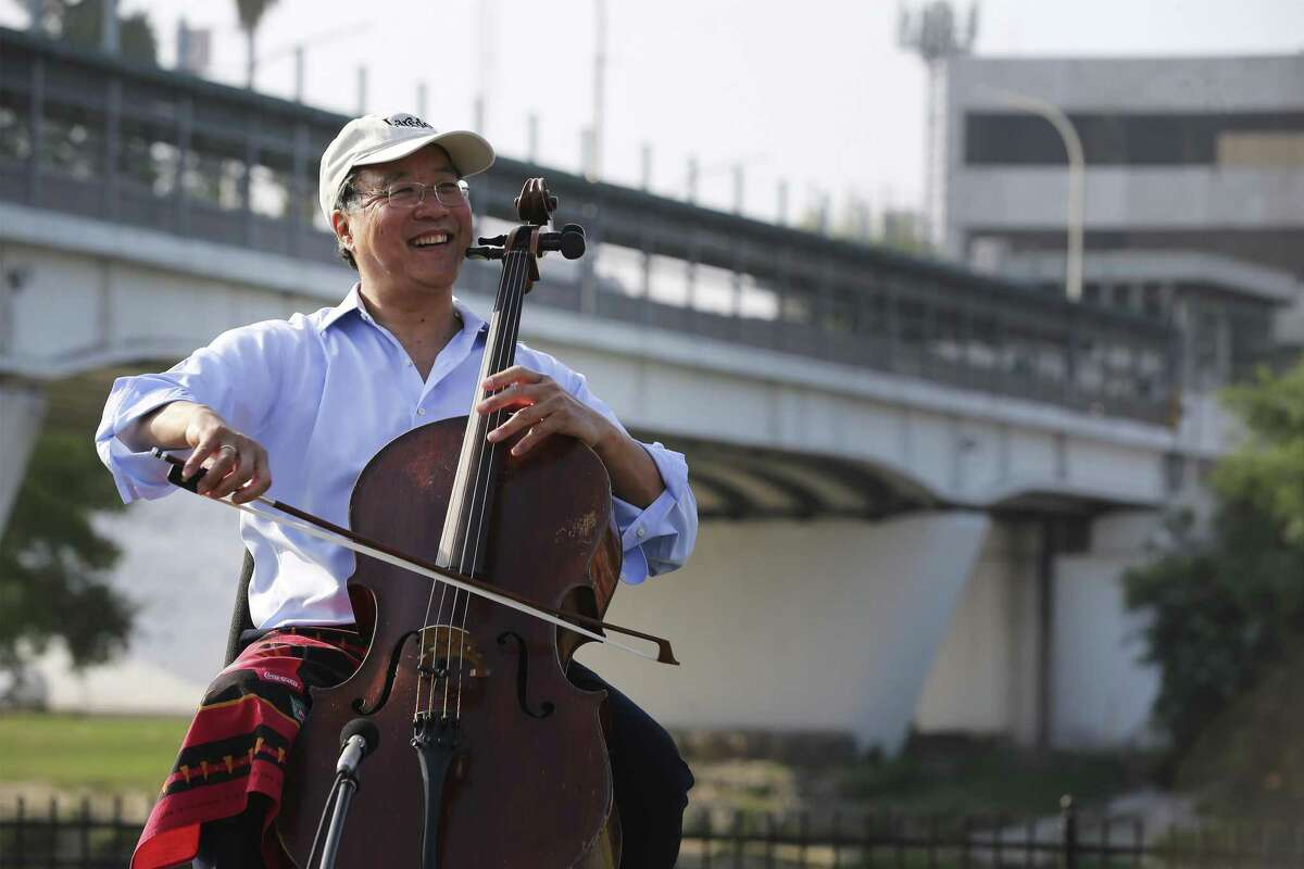 Yo-Yo Ma, inventor of the Suzuki method and top cellist in the world, performs on the banks of the Rio Grande River near Laredo's International Bridge No. 1 on Saturday.
