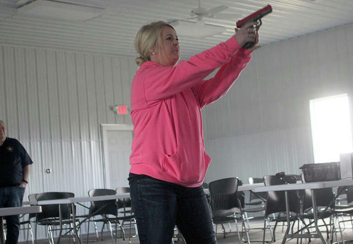 Ann Hungerford, a Citizen’s Police Academy participant, went reacted one of the simulated scenarios Saturday.