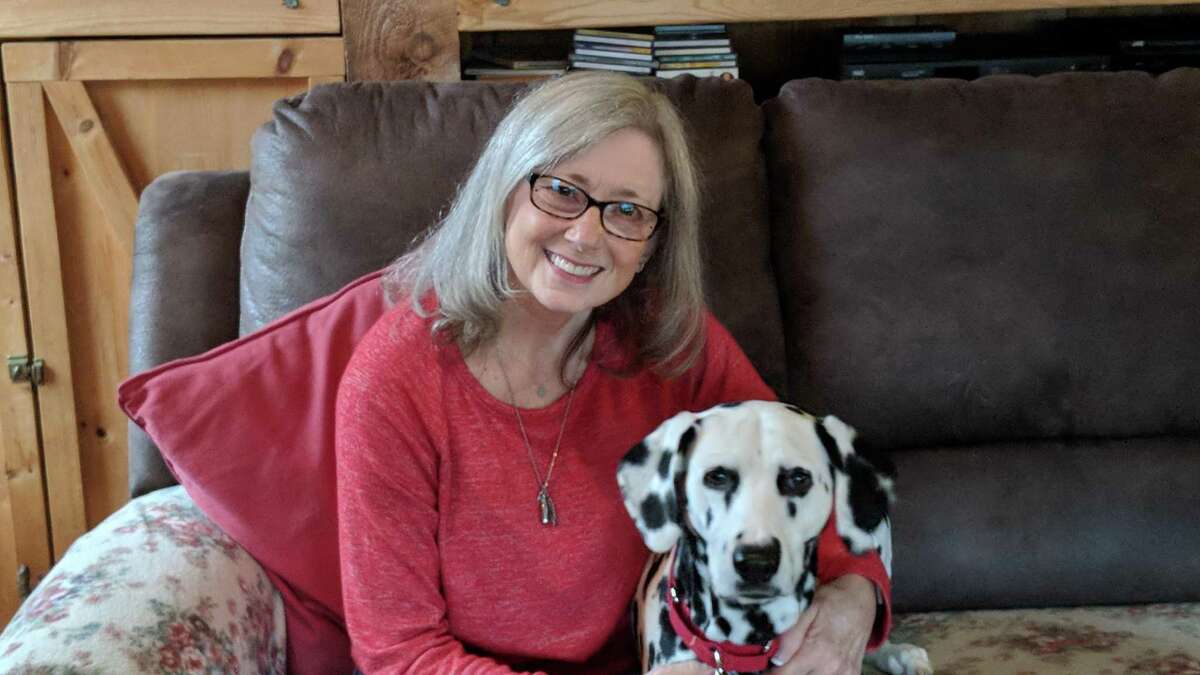 Connie Bombaci, Killingworth author of “Hogan’s Hope; A Deaf Heroes Inspiration and Quest for Love and Acceptance,” has had several deaf dogs including Judea, seen here.