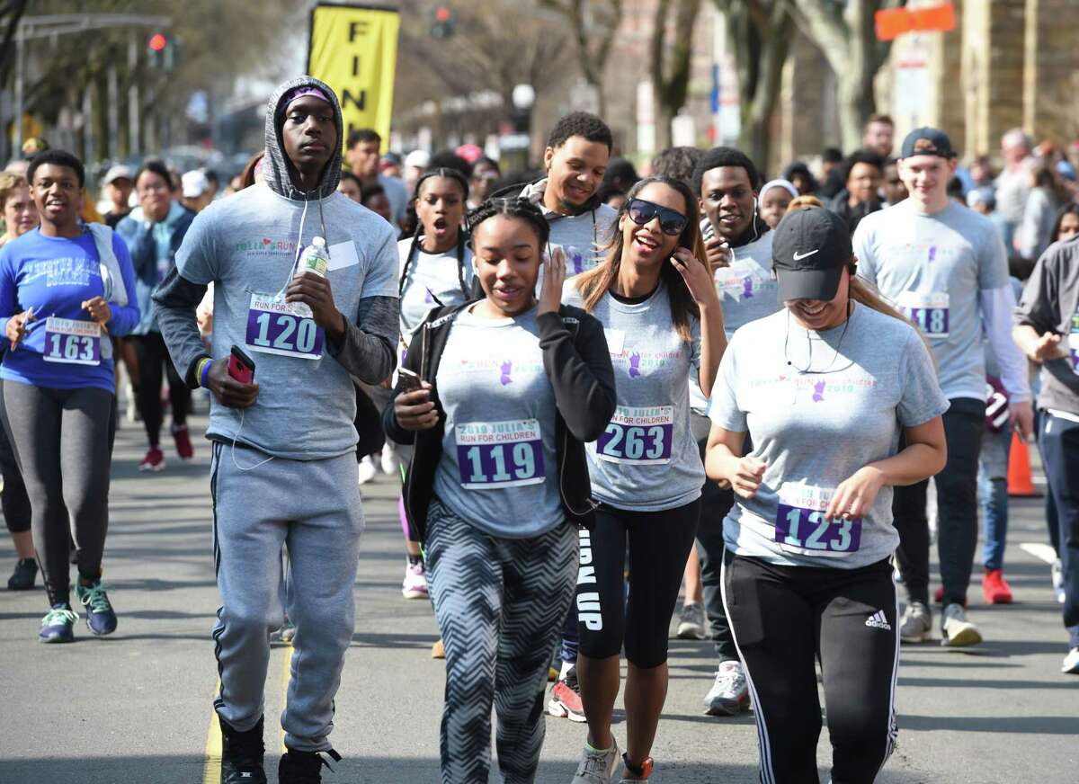 Runners begin the 20th annual Julia’s Run for Children at Yale University's Cross Campus in New Haven on April 14, 2019 with proceeds benefiting LEAP. The race celebrates the memory of Julia Rusinek, who died in 1999 as a senior at Yale University, and her commitment to running and children. The run included a 4-mile event and a .7-mile Fun Run for children.