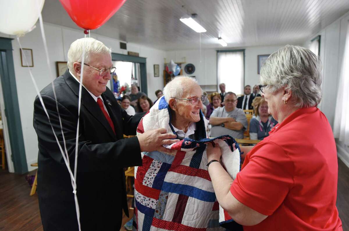 World War II veteran Edward Francis Deyoe, 97 is presented with a Quilt of Valor during the community awards ceremony on Sunday, April 14, 2019 at the Bethlehem Grange in Selkirk, NY. (Phoebe Sheehan/Times Union)
