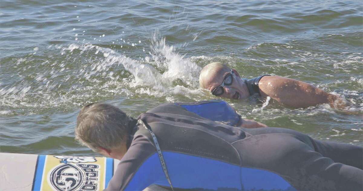 Troy Jessee, who owns Troy Jessee Construction, swam 3.5 miles of open water from San Jose Island to Key Allegro Island to raise $80,000 to build a Habitat for Humanity San Antonio house. The new home was one of 14 habitat homes dedicated on April 13.