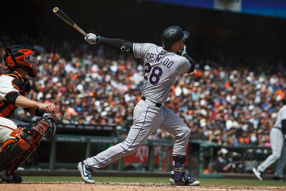 SAN FRANCISCO, CA - APRIL 14: Nolan Arenado #28 of the Colorado Rockies hits a three run home run against the San Francisco Giants during the fifth inning at Oracle Park on April 14, 2019 in San Francisco, California. The Colorado Rockies defeated the San Francisco Giants 4-0. (Photo by Jason O. Watson/Getty Images)
