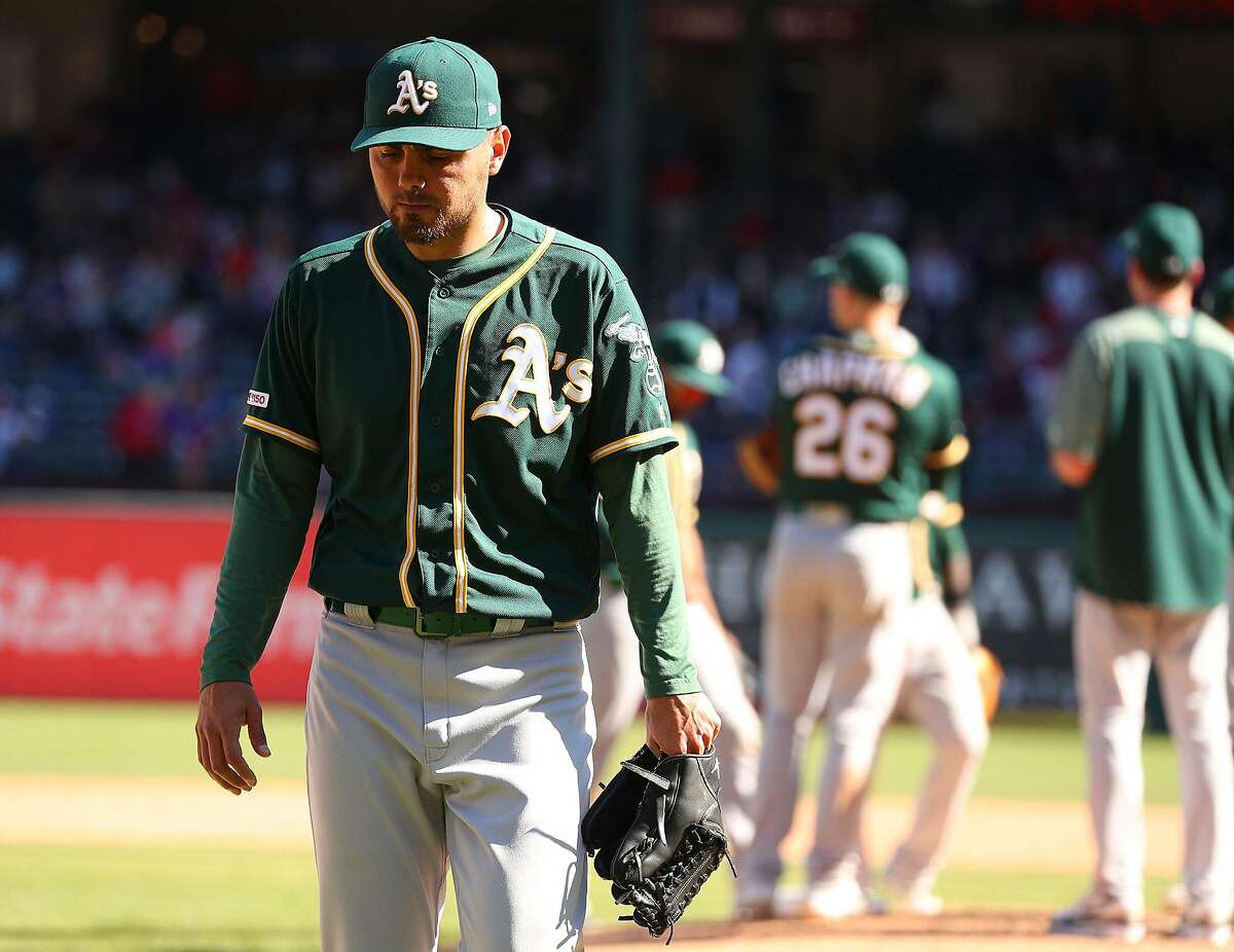Oakland Athletics relief pitcher Joakim Soria (48) leaves the game after giving up a triple to Texas Rangers' Danny Santana that scored two runs to tie the game in the eighth inning on Sunday, April 14, 2019 in Arlington, Texas. (Richard W. Rodriguez/Fort Worth Star-Telegram/TNS)
