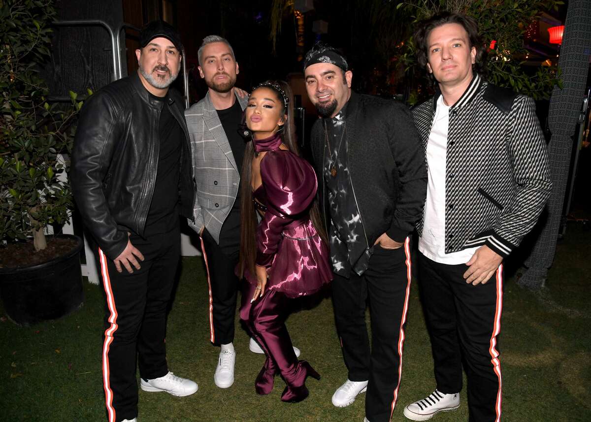 INDIO, CALIFORNIA - APRIL 14: Ariana Grande (C) with members of NSYNC Joey Fatone, Lance Bass, Chris Kirkpatrick, and JC Chasez attend 2019 Coachella Valley Music And Arts Festival on April 14, 2019 in Indio, California. (Photo by Kevin Mazur/Getty Images for AG)
