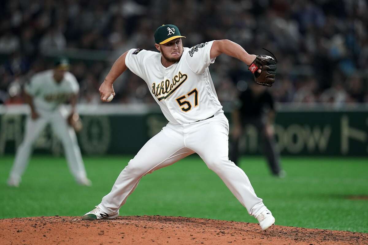TOKYO, JAPAN - MARCH 20: Pitcher J. B. Wendelken #57 of the Oakland Athletics throws in the 6th inning during the game between Seattle Mariners and Oakland Athletics at Tokyo Dome on March 20, 2019 in Tokyo, Japan. (Photo by Masterpress/Getty Images)