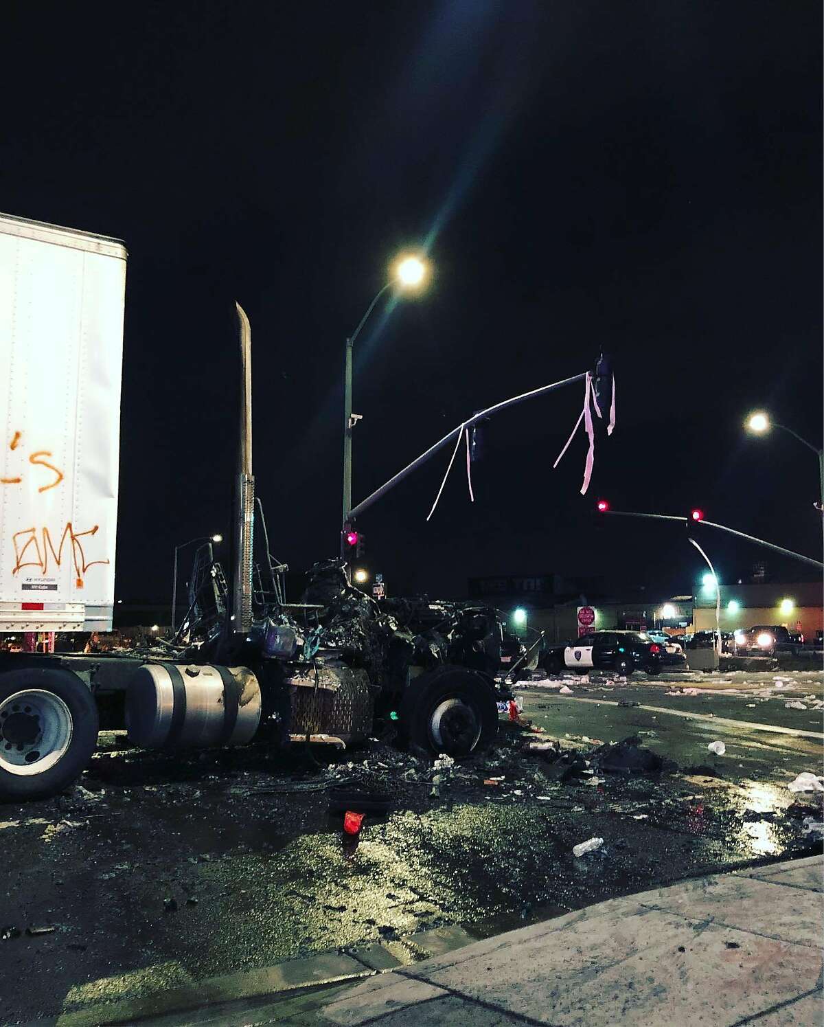 An East Oakland sideshow ended in flames Sunday night after the cab of a semi-truck and AC Transit bus caught on fire, authorities said.