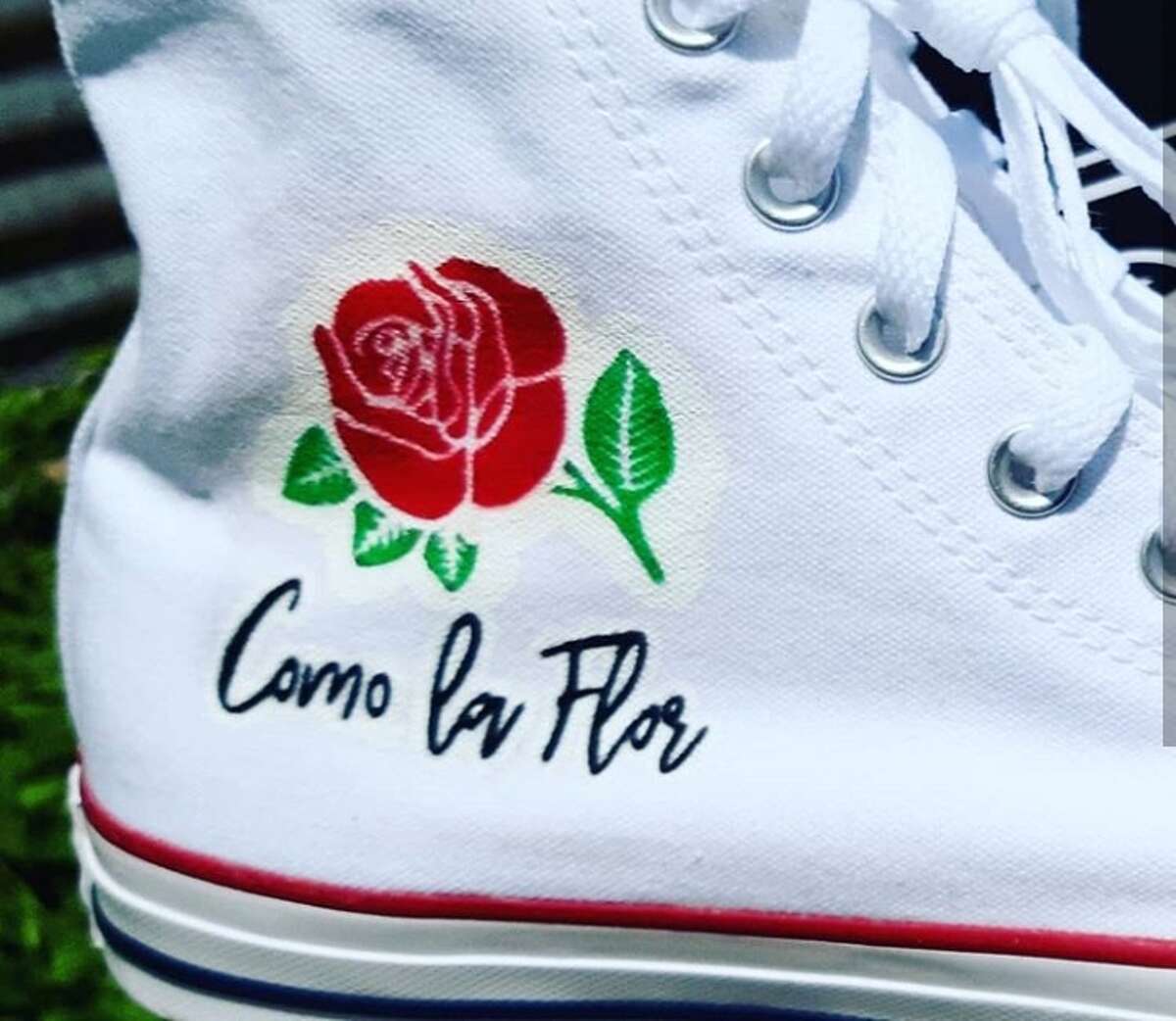 Juan Garcia III, owner of J3 Customs, created art fit for the Tejano Queen on a pair of Converse for a fan named Jorge Bernal. Garcia said Bernal contacted him with the idea to create a Selena-themed pair to wear to Fiesta de la Flor, the annual festival celebrating Selena's life and legacy, and Garcia was happy to get the job done.