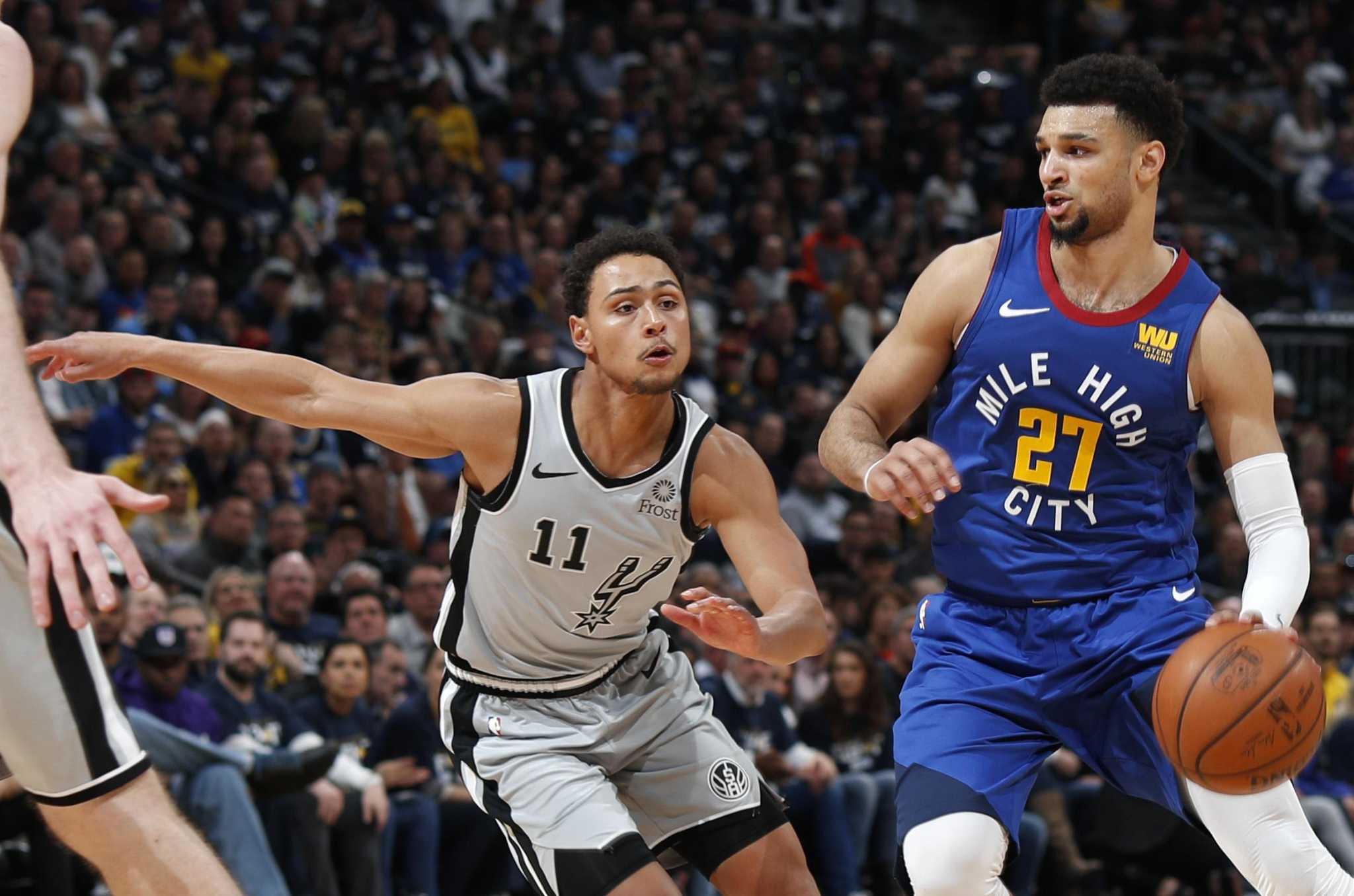 Two Denver Nuggets starters serve nuggets at local fast-food joint