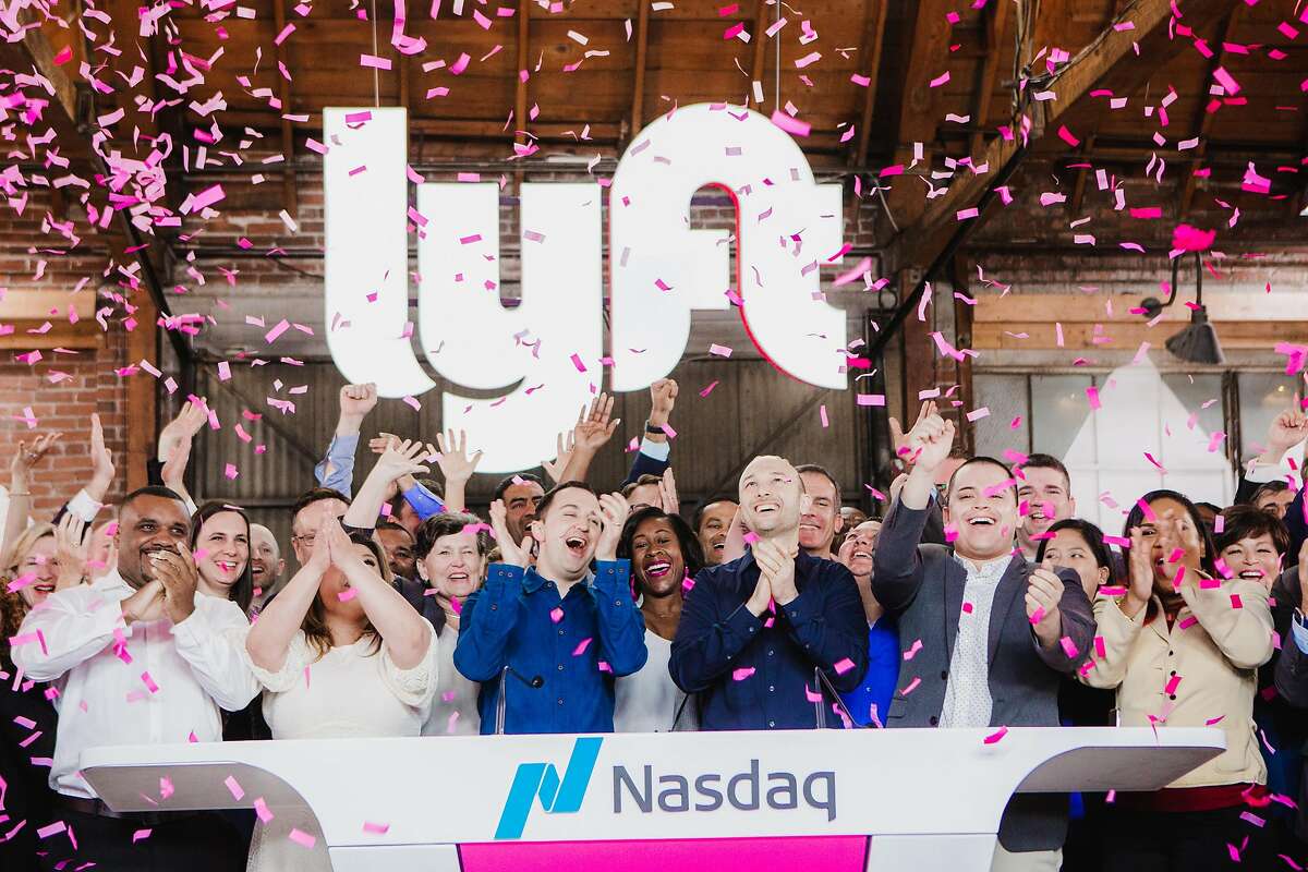 FILE -- Lyft co-founders John Zimmer, center left, and Logan Green, center right, at the company’s IPO party in Los Angeles, March 29, 2019. With so many tech firms listing their shares this year, each is trying to avoid the traffic jam to get their own moment in the sun. (Alex Welsh/The New York Times)