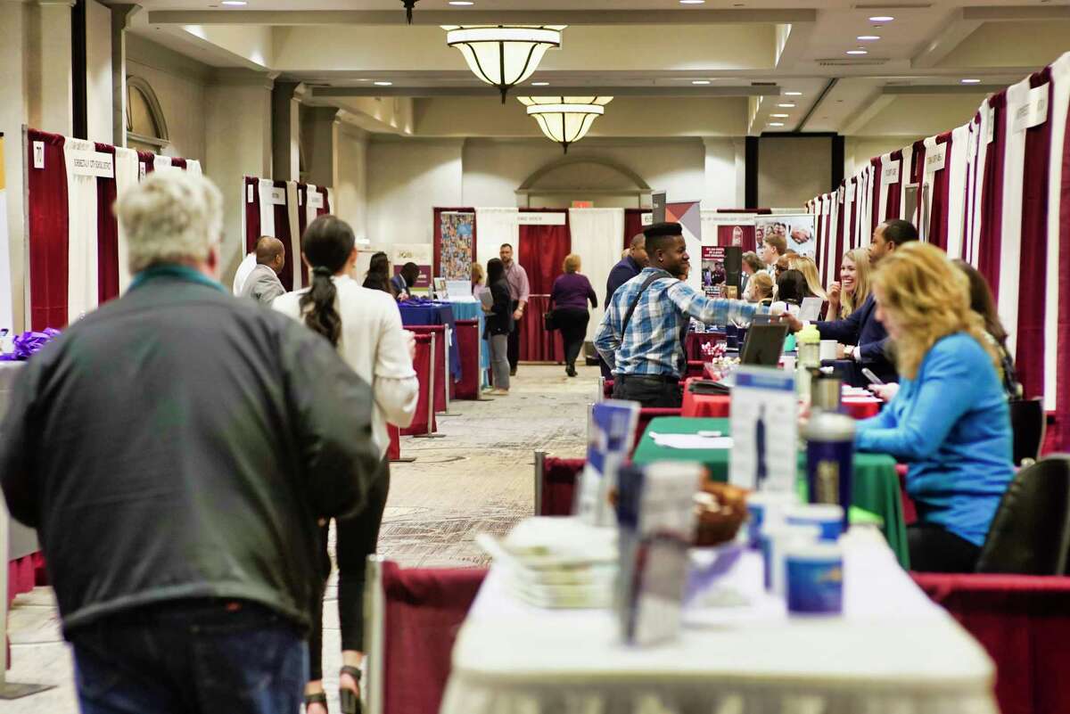 People make their way around to talk to the various employers at the Times Union Job Fair at the Albany Marriott hotel on Monday, April 15, 2019, in Albany, N.Y. (Paul Buckowski/Times Union)