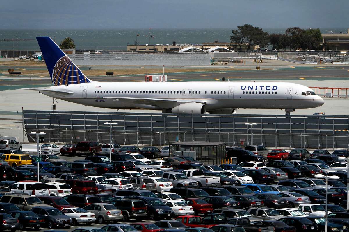 Cars sit in the parking lots at San Francisco International Airport in South San Francisco, Calif., Thursday, May 24, 2012. San Mateo County has three taxes on the June 6 ballot aimed at rental cars, parking and hotels around the airport.