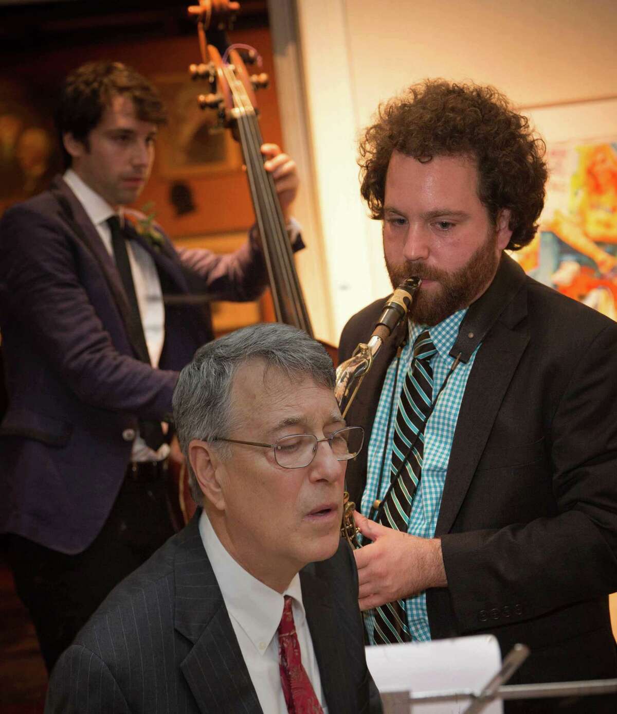 “The Library Suite,” a multi-media jazz premiere, is taking place at the Pequot Library in Fairfield April 28. The music is by Fairfield resident Mark Edinberg, front, who will perform with his sons, Dan (bass) and Joel Edinberg (sax and a new woodwind instrument called a Vindor ES1).