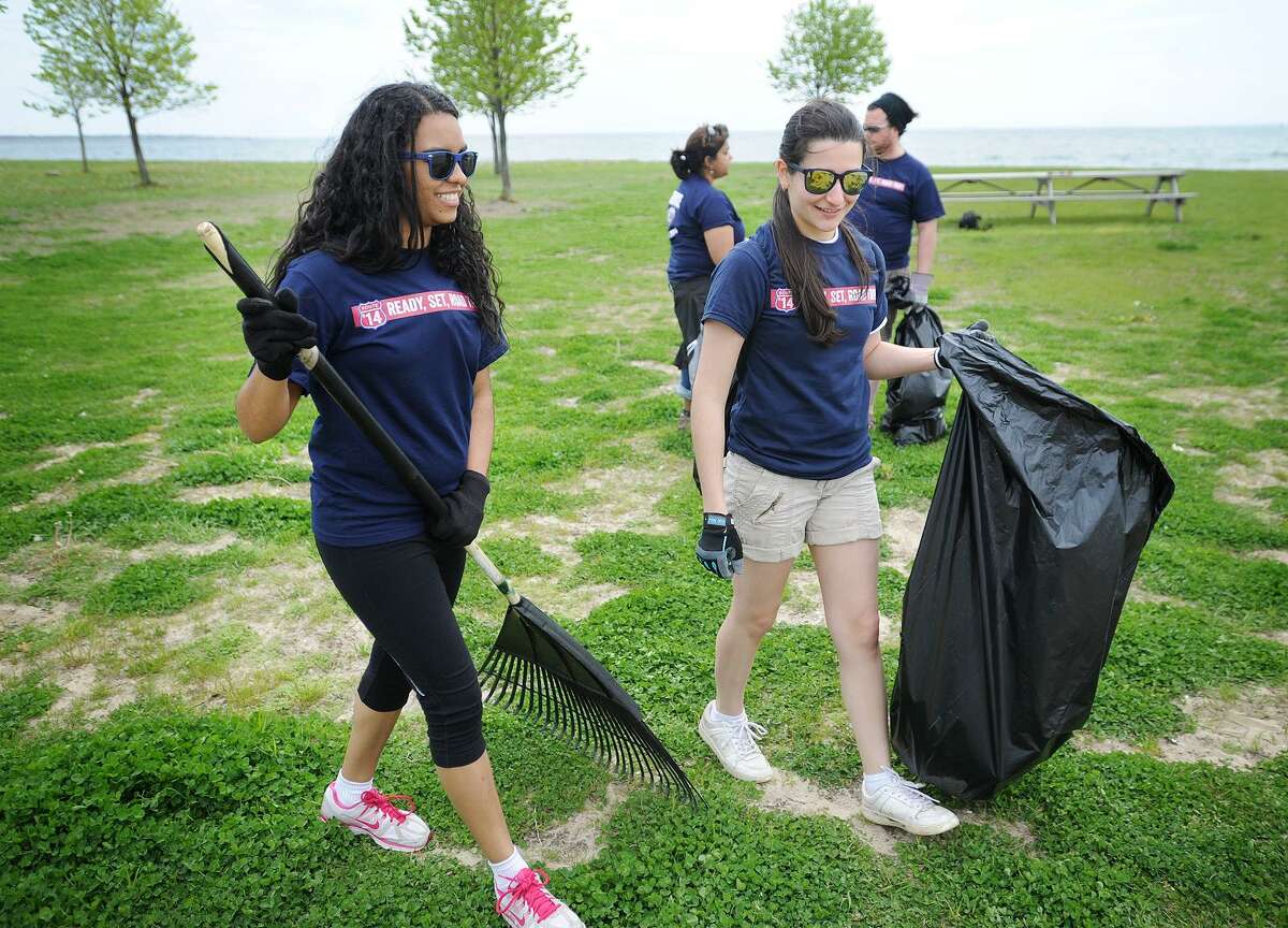File photo showing then-Fairfield University seniors Pauline Santos, left, and Camile Gomes, clean up Seaside Park in Bridgeport Conn. on Tuesday, May 13, 2014.