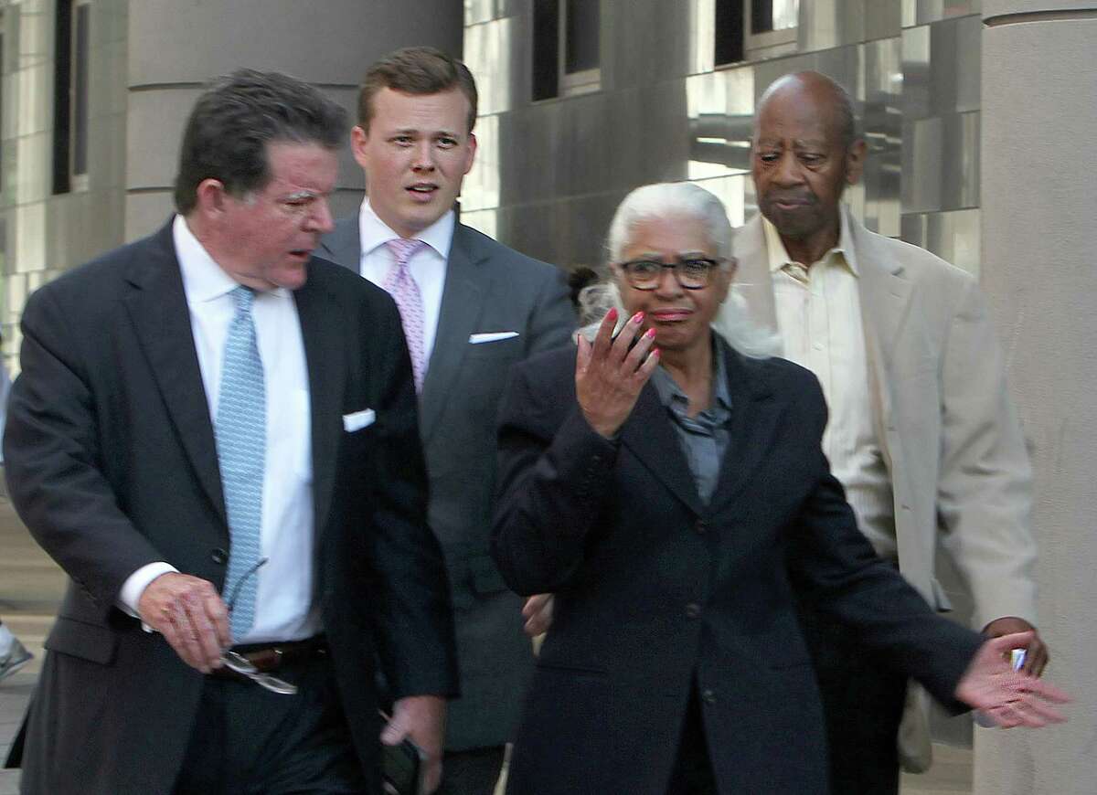 The founding superintendent of Houston's Varnett charter school, Marian Annette Cluff, and her husband, Alsie Cluff Jr., the school's former facilities manager, leave the courtroom with their attorneys, Dan Cogdell and Cordt Akers. The Cuffs turned themselves into federal authorities in 2015 after being indicted on charges of embezzling more than $2.6 million from the school network. ( Dylan Aguilar / Houston Chronicle )