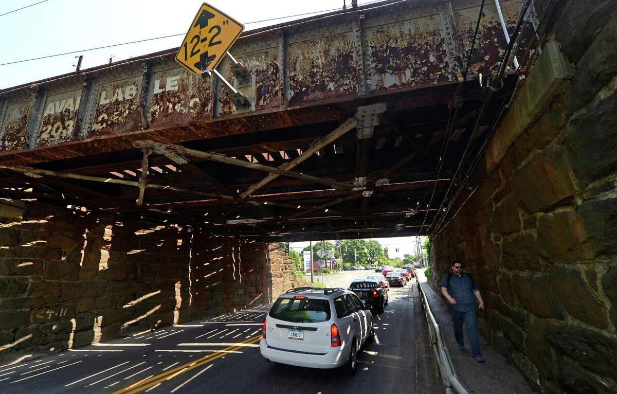 Traffic goes under the railroad bridge spanning East Ave. in Norwalk, Conn. Friday, May 27, 2016. The Connecticut Department of Transportation project to replace the Walk Bridge over the Norwalk River also includes plans to replace other Metro-North bridges along the New Haven Line including the spans over East and Osbourne avenue.