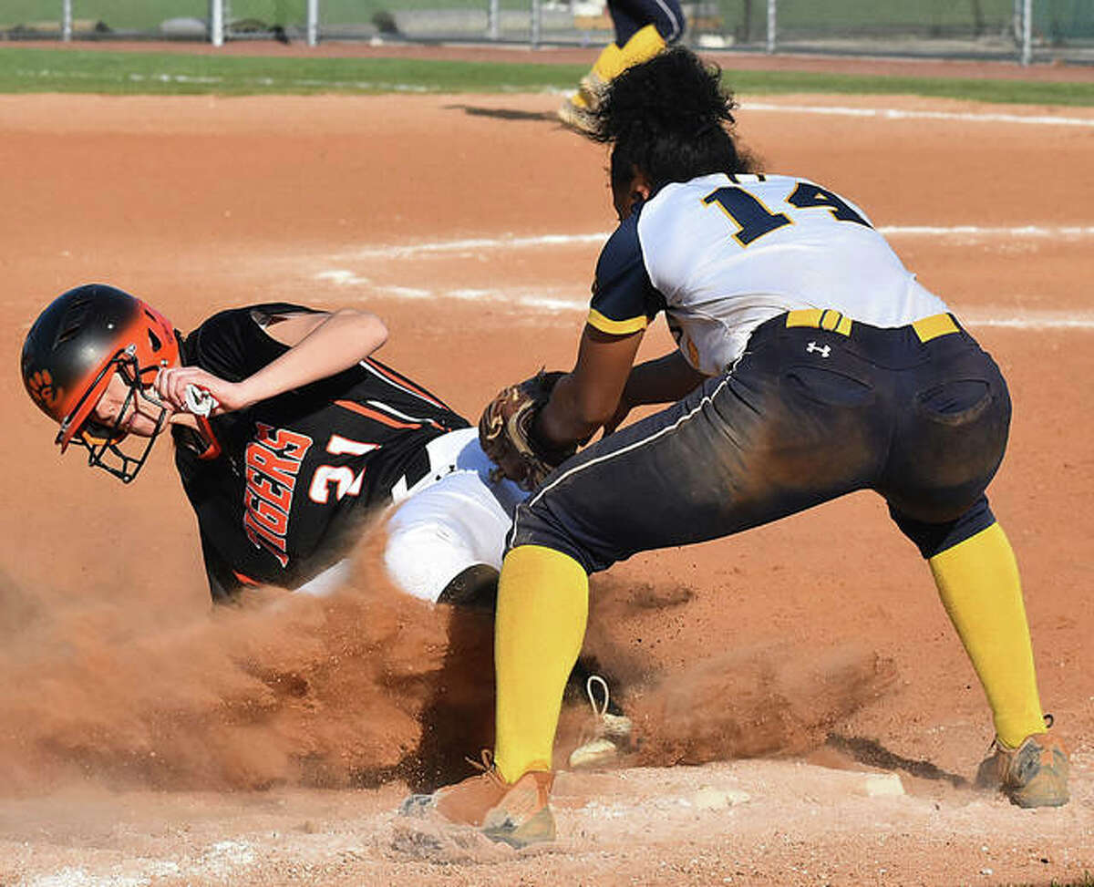 Edwardsville’s Kylee Myers slides safely into third base against O’Fallon on Tuesday in O’Fallon.