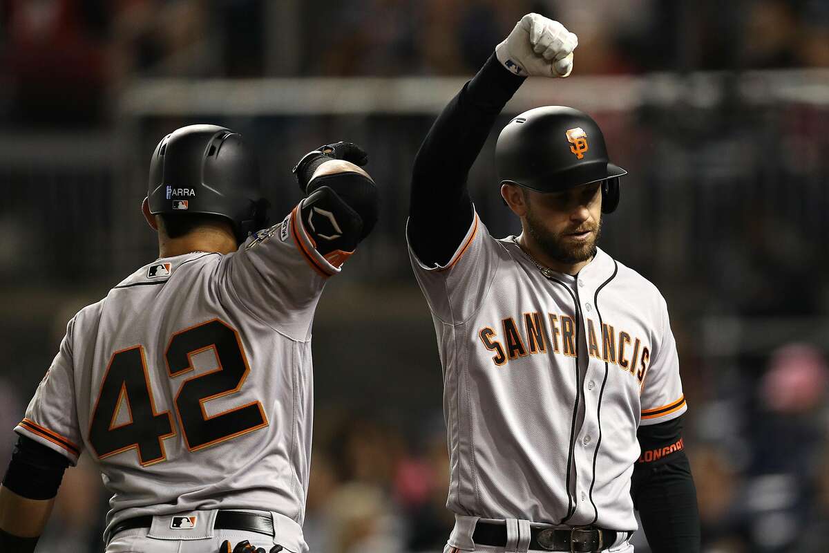 WASHINGTON, DC - APRIL 16: Evan Longoria #10 of the San Francisco Giants celebrates after hitting a home run against the Washington Nationals during the fifth inning at Nationals Park on April 16, 2019 in Washington, DC. All uniformed players and coaches are wearing number 42 in honor of Jackie Robinson Day. (Photo by Patrick Smith/Getty Images)