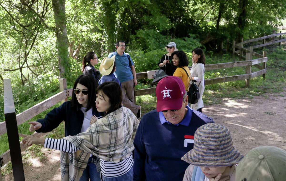 A group of English-language learners, including Yuka Meadows, from front left, and Hatsumi Sugiura, both from Japan, walk through Washington-on-the-Brazos State Park on Monday, April 15, 2019, in Washington, Texas. About 40 people from 24 countries visited the park on a trip organized by St. John the Divine Episcopal Church.