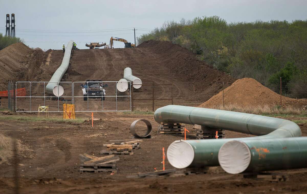 (FILES) In this file photo taken on March 12, 2019 the Double Eagle Pipeline is built just outside Cotulla, Texas, for future transport of crude oil from the Eagle Ford basin to the port of Corpus Christi.