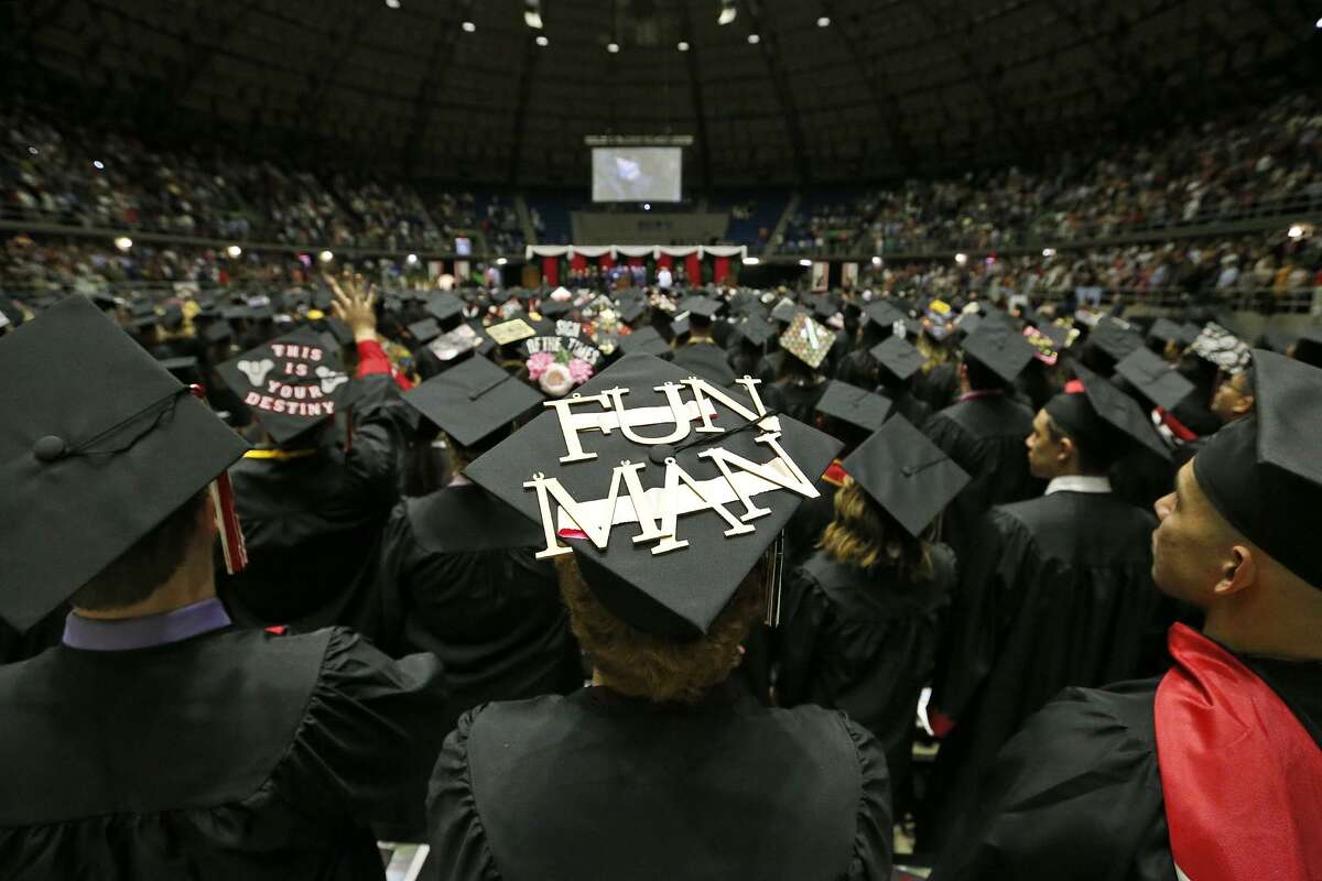 University of the Incarnate Word graduates enter the Freeman Coliseum, Saturday May 12, 2018, for their commencement ceremony.