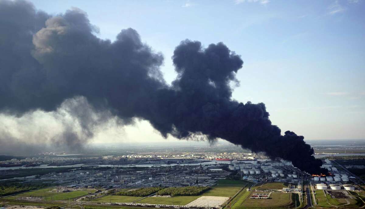 In this March 18, 2019 file photo, a plume of smoke rises from a petrochemical fire at the Intercontinental Terminals Company in Deer Park, Texas. (AP Photo/David J. Phillip)