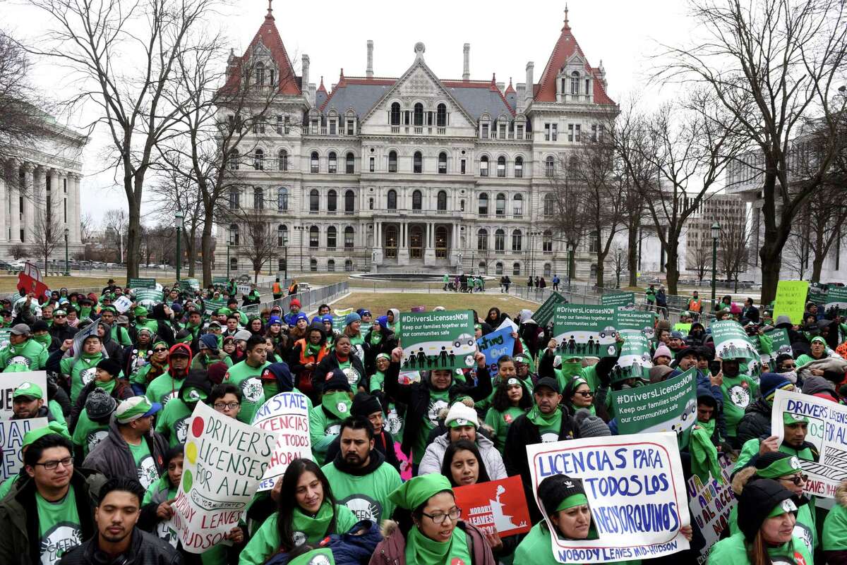 Protesters with the Green Light Campaign to get driver licenses for undocumented immigrants, take part in a rally in West Capitol Park on Tuesday, March 12, 2019, in Albany, N.Y. New York currently bars immigrants from obtaining a license due to their immigration status. (Will Waldron/Times Union)