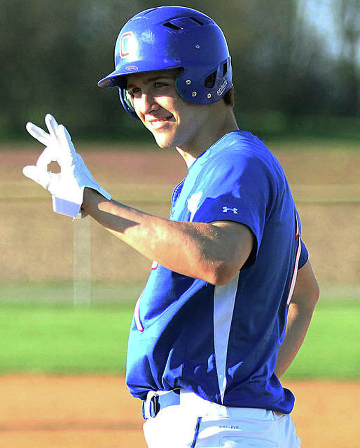 Carlinville’s Kyle Dixon acknowledges teammates in the dugout after his single Tuesday at Litchfield. Dixon, a SIUC recruit, is scheduled to make his first pitching start of the season Friday at Staunton.