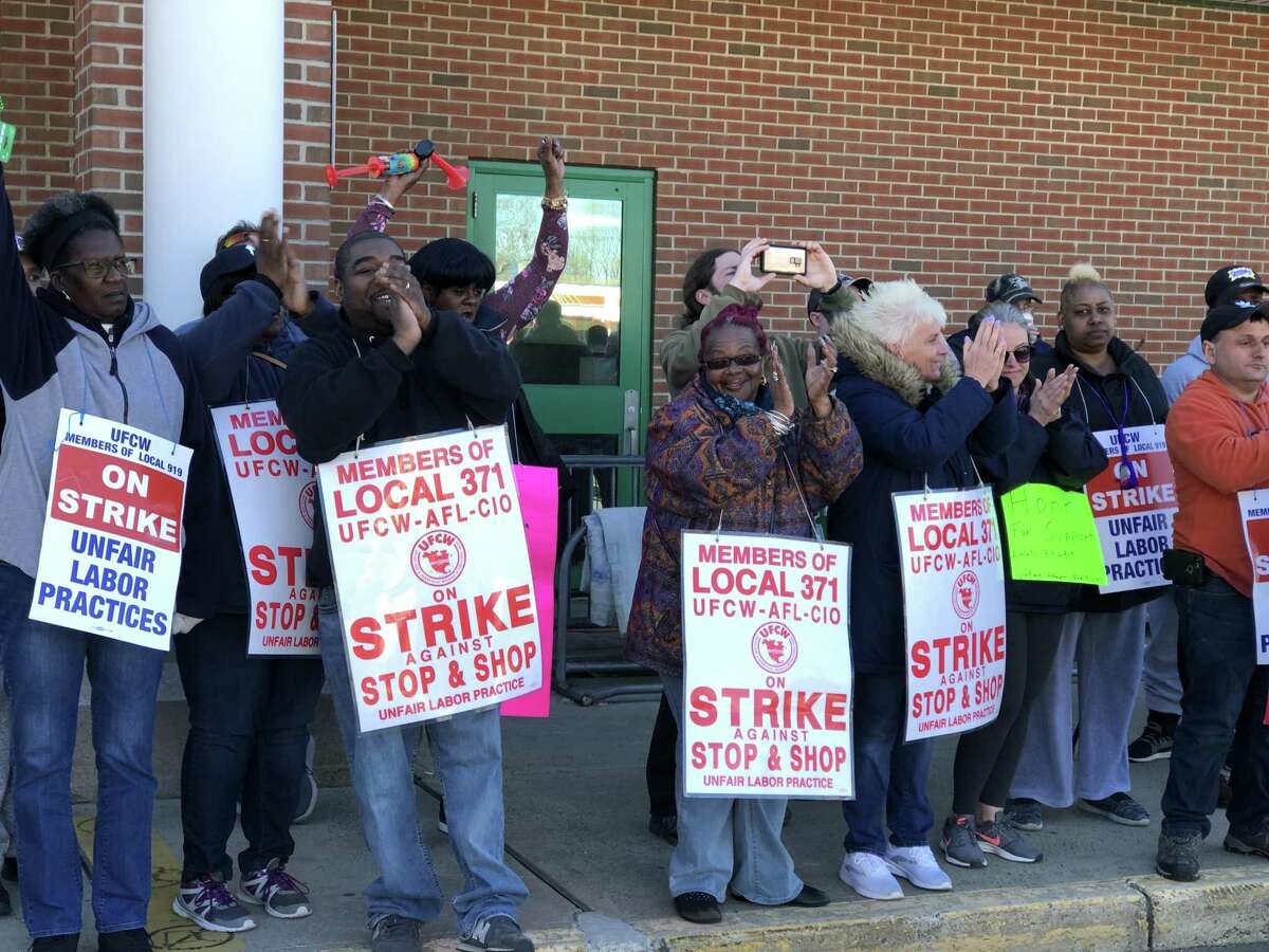 New Haven police and firefighters came out to stand with striking Stop & Shop workers at the store's Whalley Avenue location Wednesday.