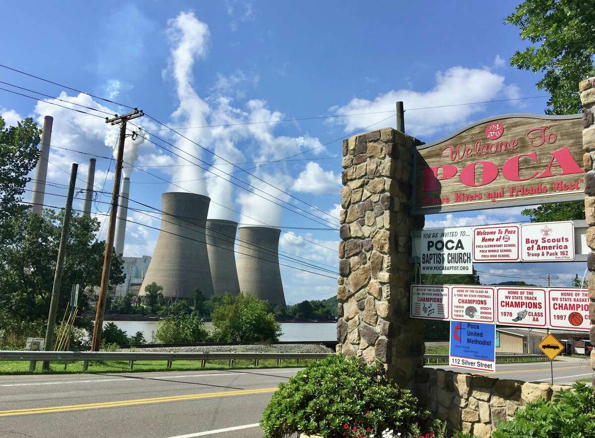 In this Aug. 23, 2018 photo, American Electric Power’s John Amos coal-fired plant in Winfield, W.Va., is seen from the town of Poca across the Kanawha River. President Donald Trump picked West Virginia where he announced rolling back pollution rules for coal-fired power plants. But he didn’t mention that the northern two-thirds of West Virginia, with the neighboring part of Pennsylvania, would be hit hardest. (AP Photo/John Raby)