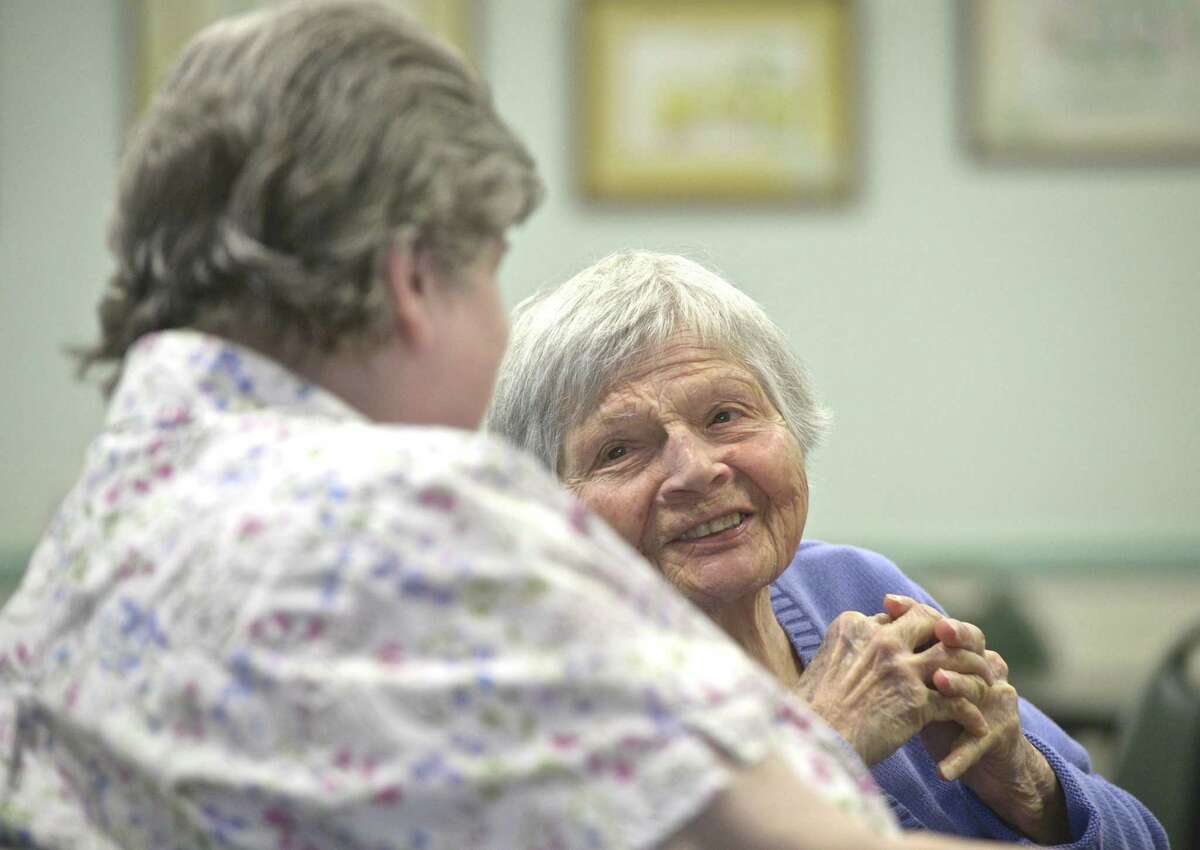 Mary Devere, right, of Sherman, talks with Esther Curley, of New Milford, at the Senior Center in New Milford. The center and the Community Culinary School of Northwestern Connecticut have teamed up to offer locally made meals to seniors. Wednesday, April 17, 2019, in New Milford, Conn.