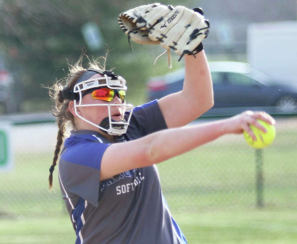 Marquette Catholic’s Taylor Whitehead took a no-hitter to the 12th inning, but three walks and a grand slam enabled Hillsboro to beat the Explorers 4-0 in 12 innings at Moore Park in Alton. She is shown pitching earlier this season.