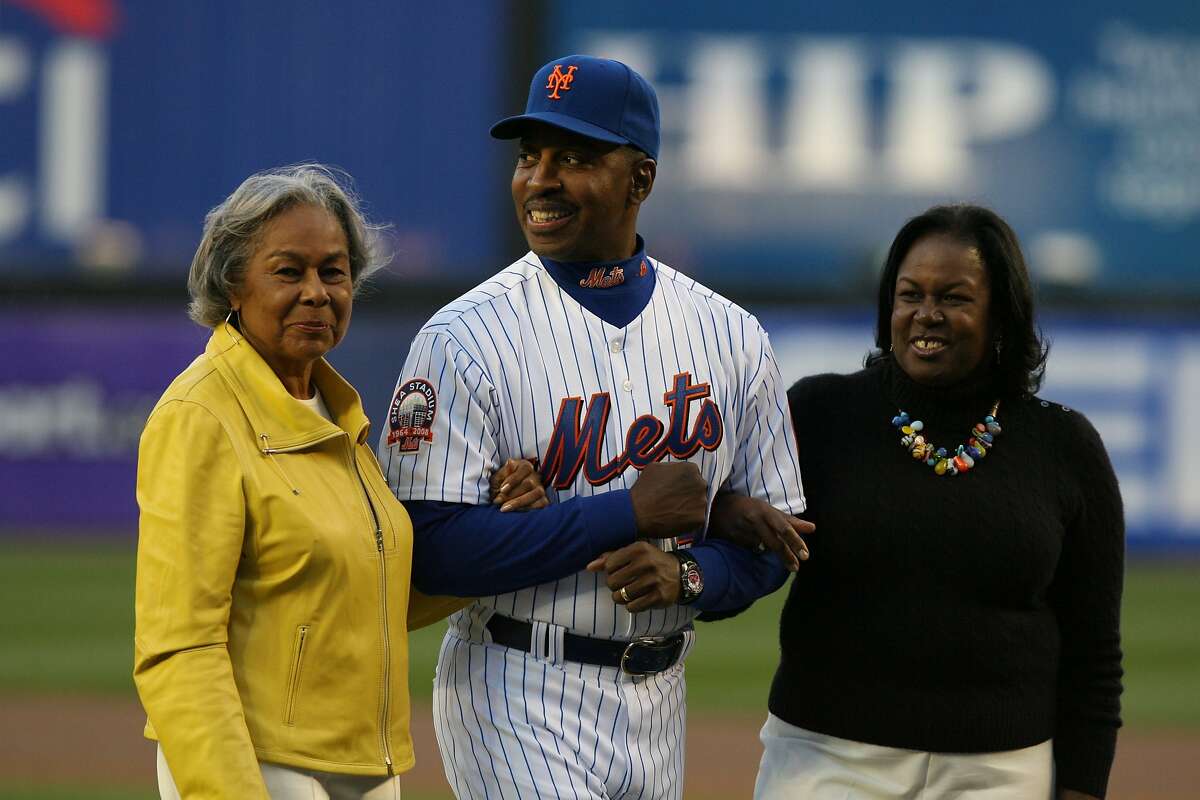 **CORRECTS NAME OF JACKIE ROBINSON'S WIDOW TO RACHEL, NOT SHARON** New York Mets manager Willie Randolph, center, escorts Rachel Robinson, left, widow of Jackie Robinson, and Robinson's daughter Sharon, right, from the field after a ceremony honoring Jackie Robinson before the Washington Nationals faced the New York Mets in their baseball game on Jackie Robinson Day at Shea Stadium in New York, Tuesday, April 15, 2008. (AP Photo/Kathy Willens)