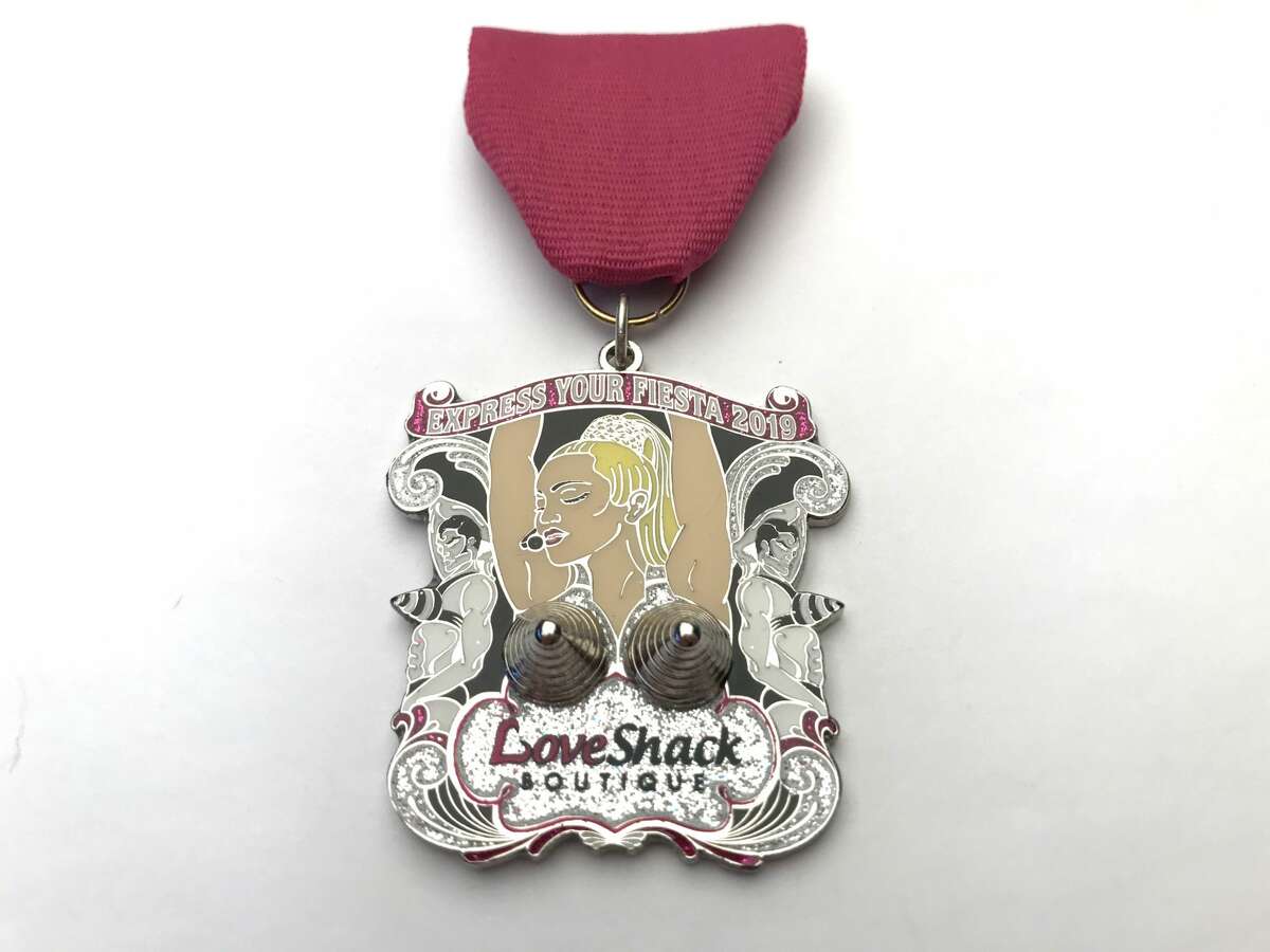 The following are adult-themed medals from Fiesta 2019. Love Shack Boutique: Strike a Pose medal